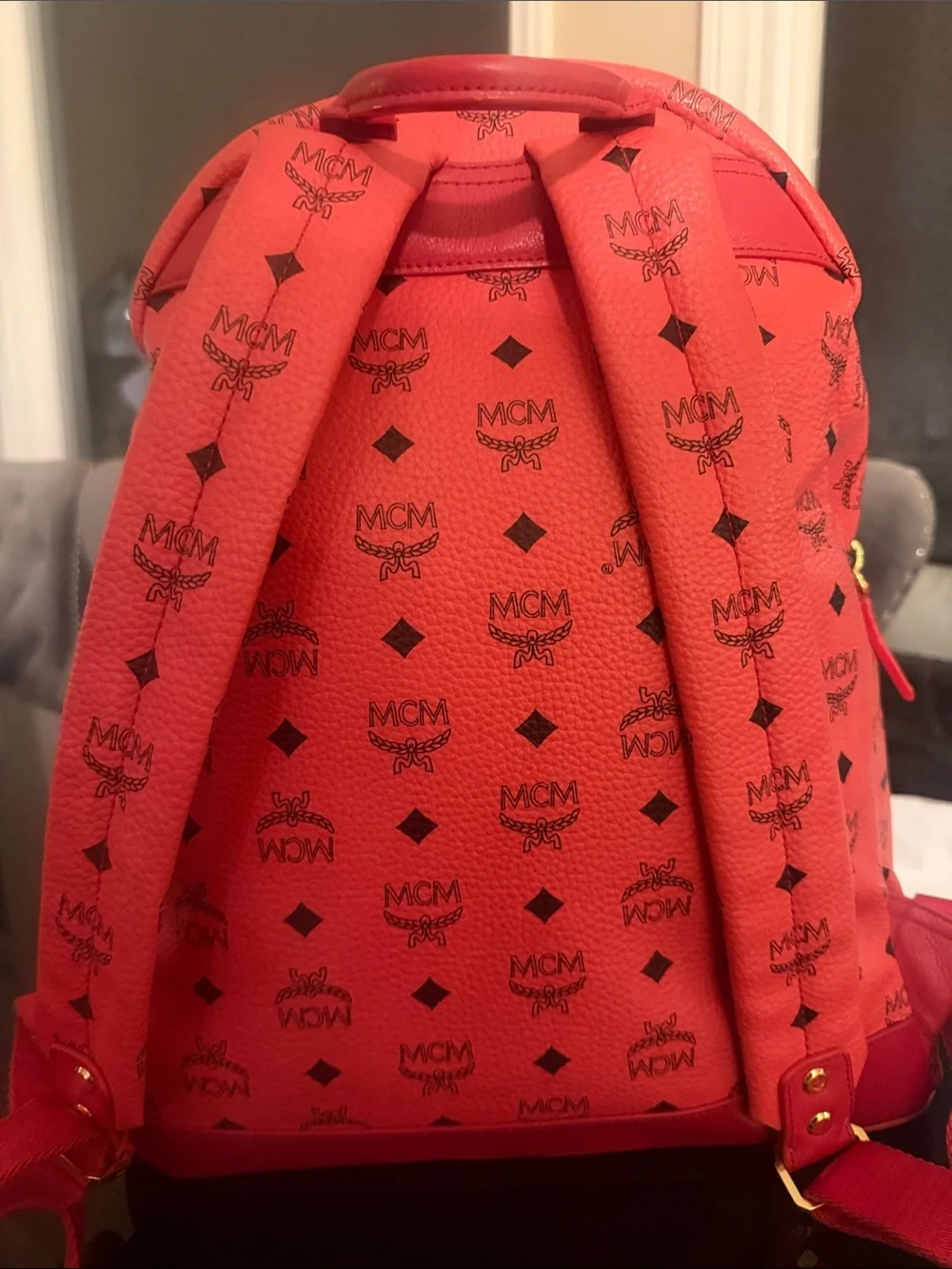 MCM Red Logo Pyramid Stud Backpack with Gold & Silver Accents